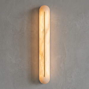 Front view of a Hoailamp brass-slotted alabaster linear wall sconce with a warm golden glow