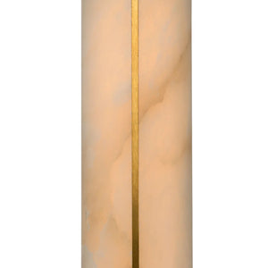 Close-up of the brushed brass centerline glowing through natural veins on a Hoailamp alabaster sconce