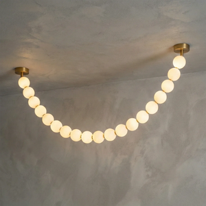 Dazzling Pearl Necklace Chandelier - Studio Grey Concrete Backdrop Single Strand Wide Drape Lit | HoaiLamp
