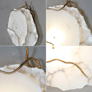 Hand-carved alabaster lamp with gold accents, showcasing natural stone texture and warm glow.