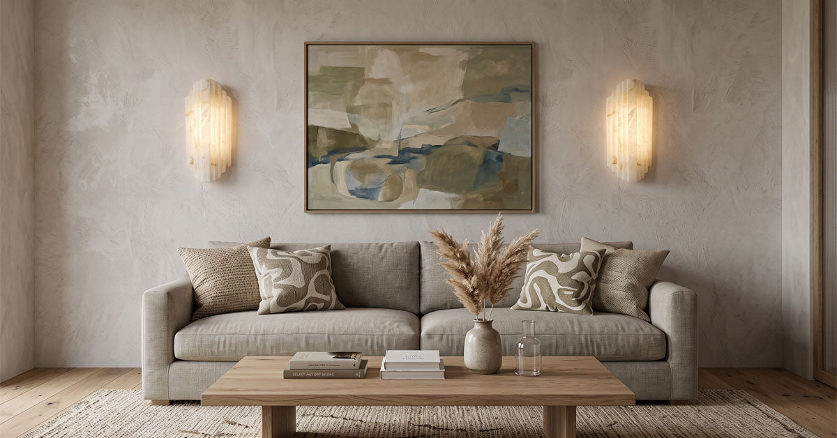 Alabaster wall sconces flanking a fireplace