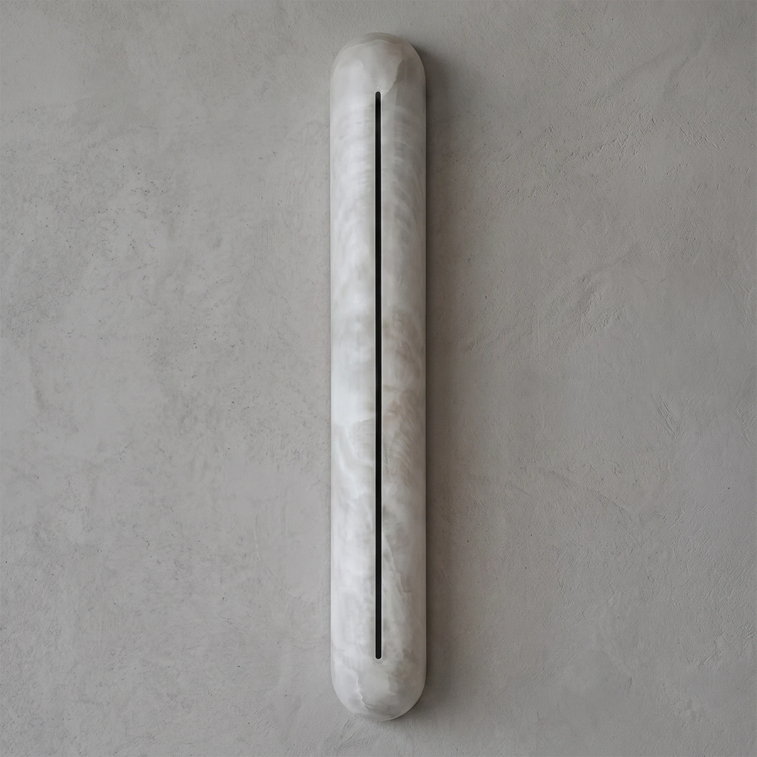 Hoailamp alabaster linear wall sconce unlit, showing the minimalist pill-shaped natural limestone body