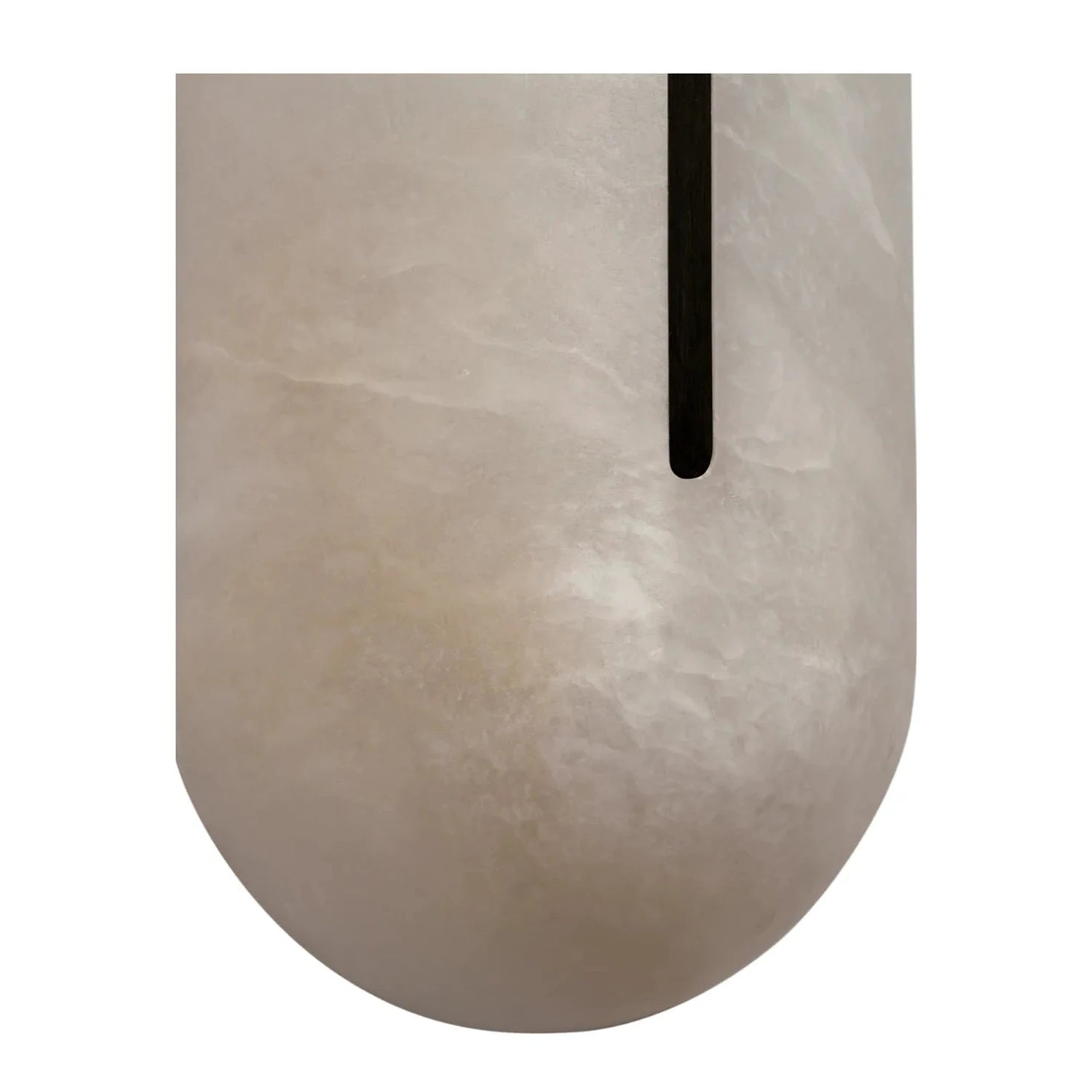 Macro craftsmanship detail of the matte black centerline slot on a Hoailamp alabaster wall sconce
