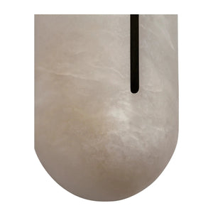 Macro craftsmanship detail of the matte black centerline slot on a Hoailamp alabaster wall sconce