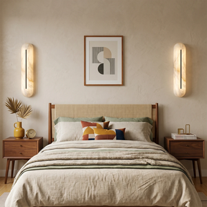 Pair of alabaster linear LED wall sconces by Hoailamp mounted symmetrically as bedside reading lights