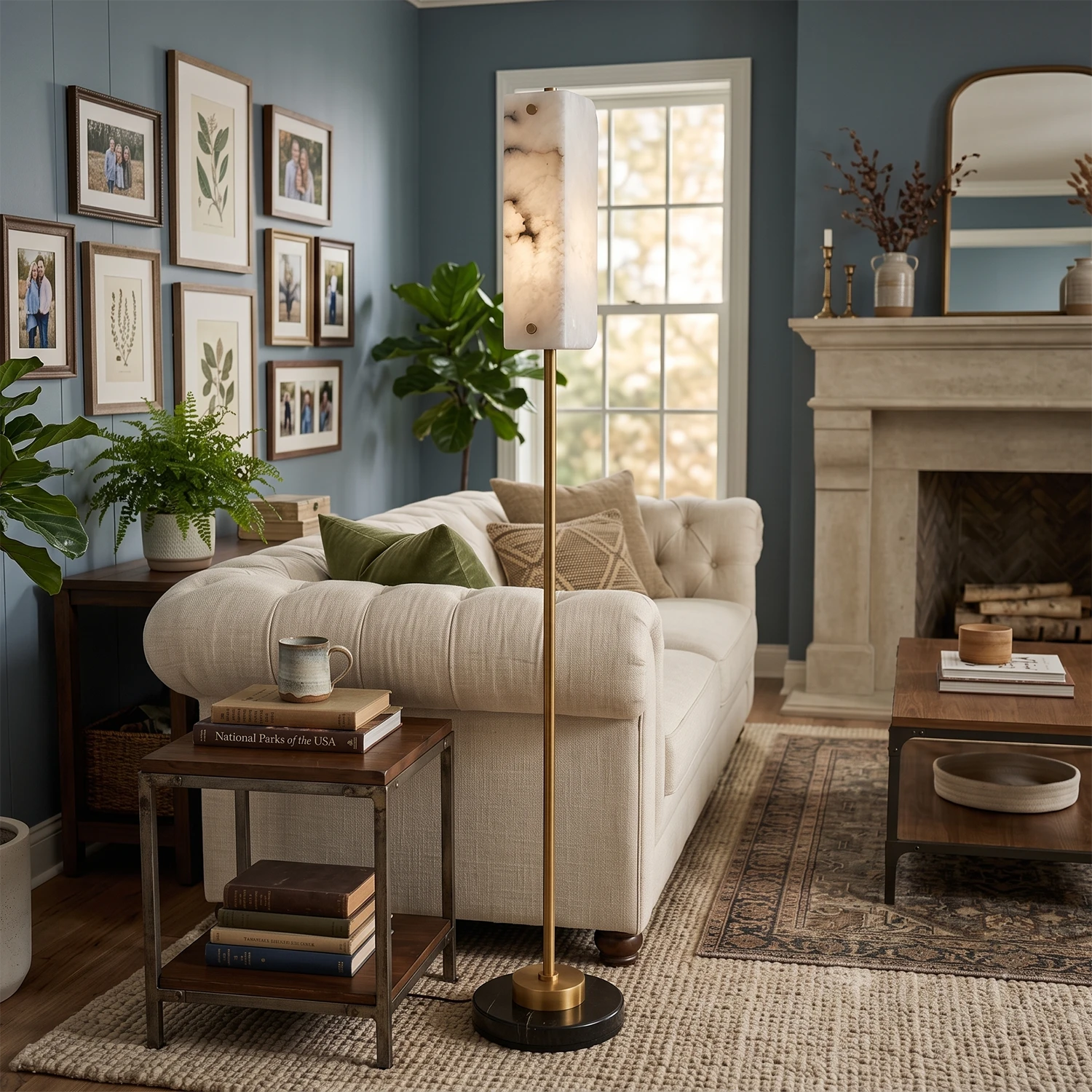 The Alabaster Panel Floor Lamp glowing beside a sofa near a fireplace.