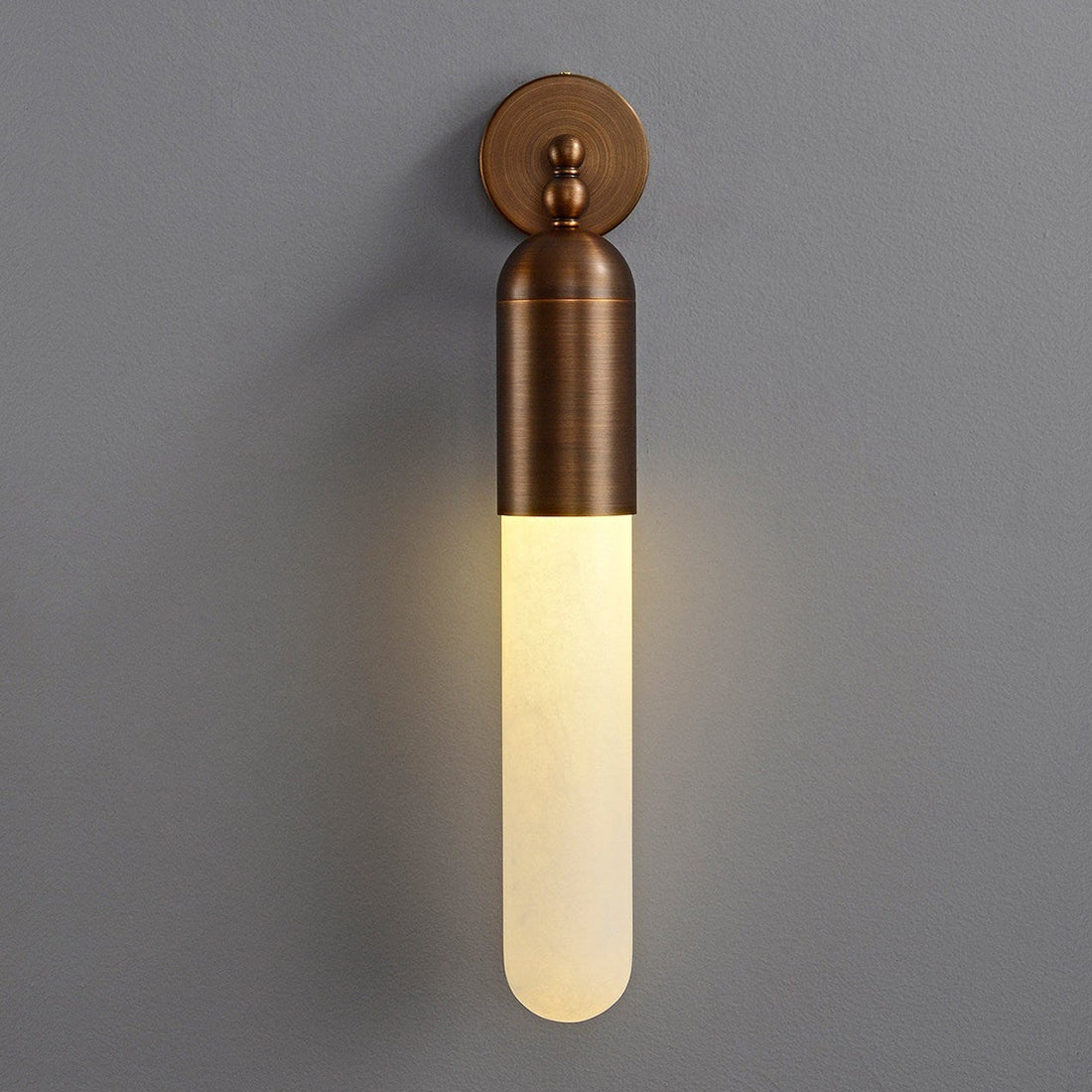 Alabaster Tube Wall Sconce - Studio Grey Background Front Lit Warm Glow | HoaiLamp