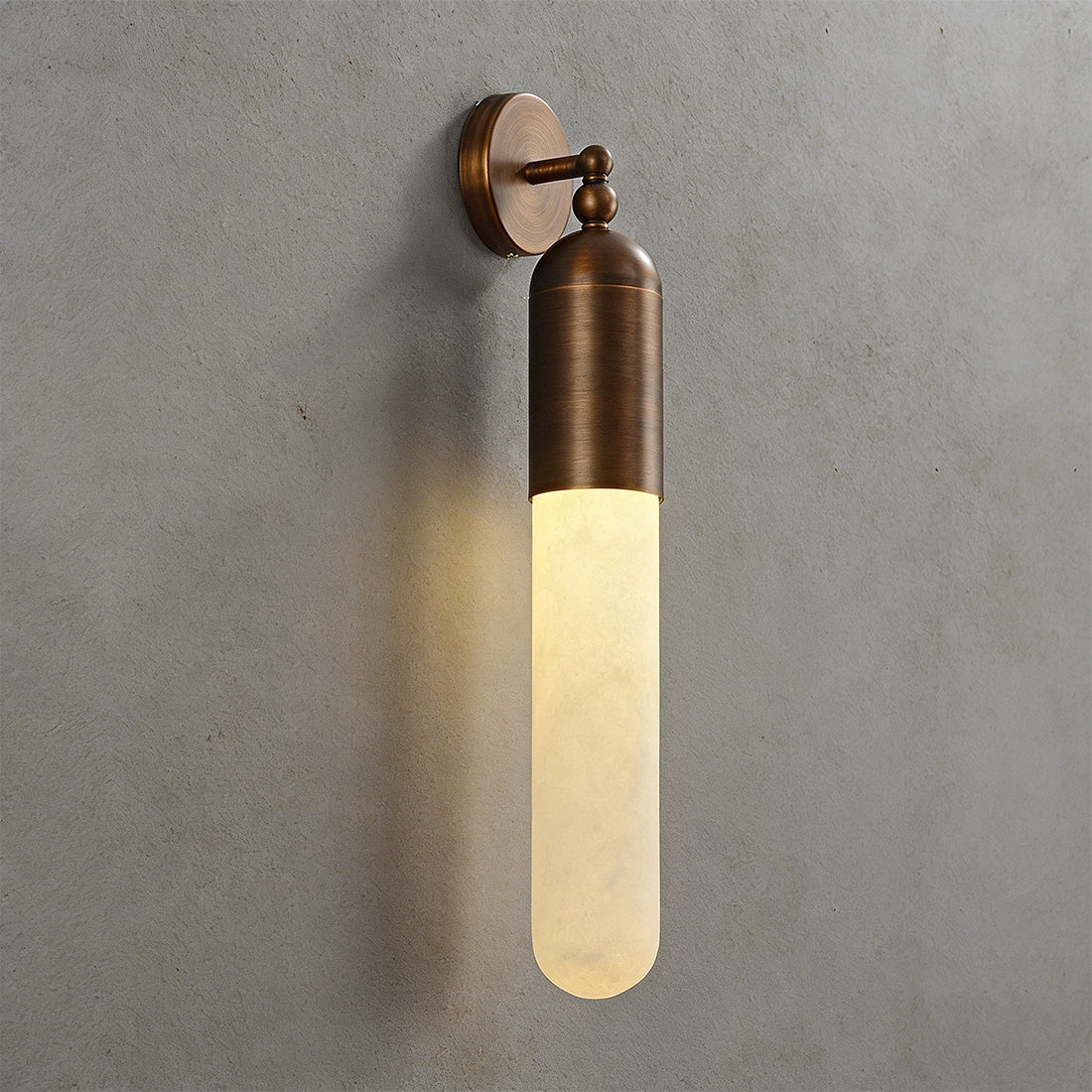 Alabaster Tube Wall Sconce - Studio Textured Grey Wall Warm Glow Close Up | HoaiLamp