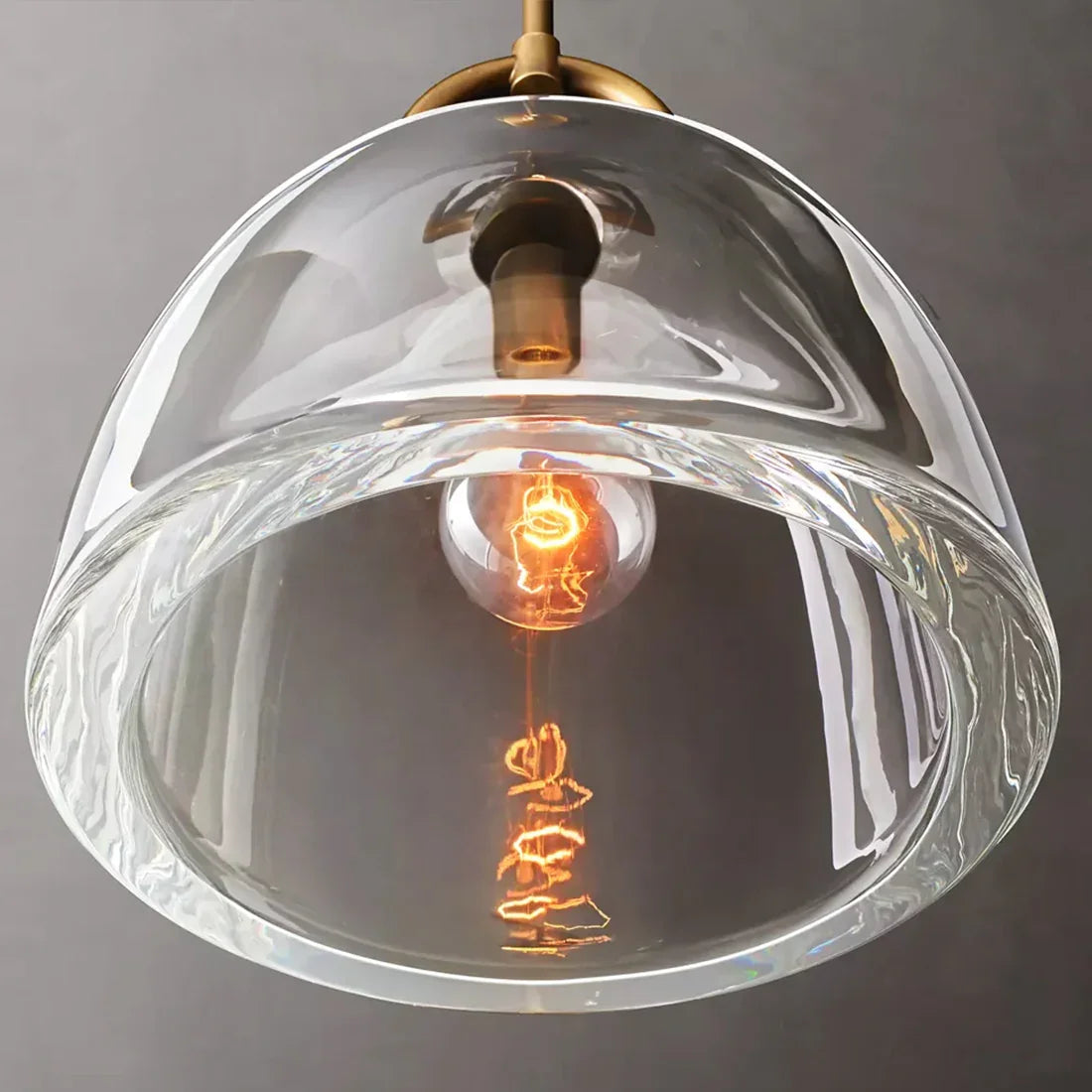 Auric Round Pendant Light by Hoailamp - Clear ribbed glass shade and Edison bulb bottom view