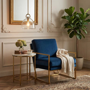 Auric Round Pendant Light by Hoailamp - Royal blue armchair with brass accent corner