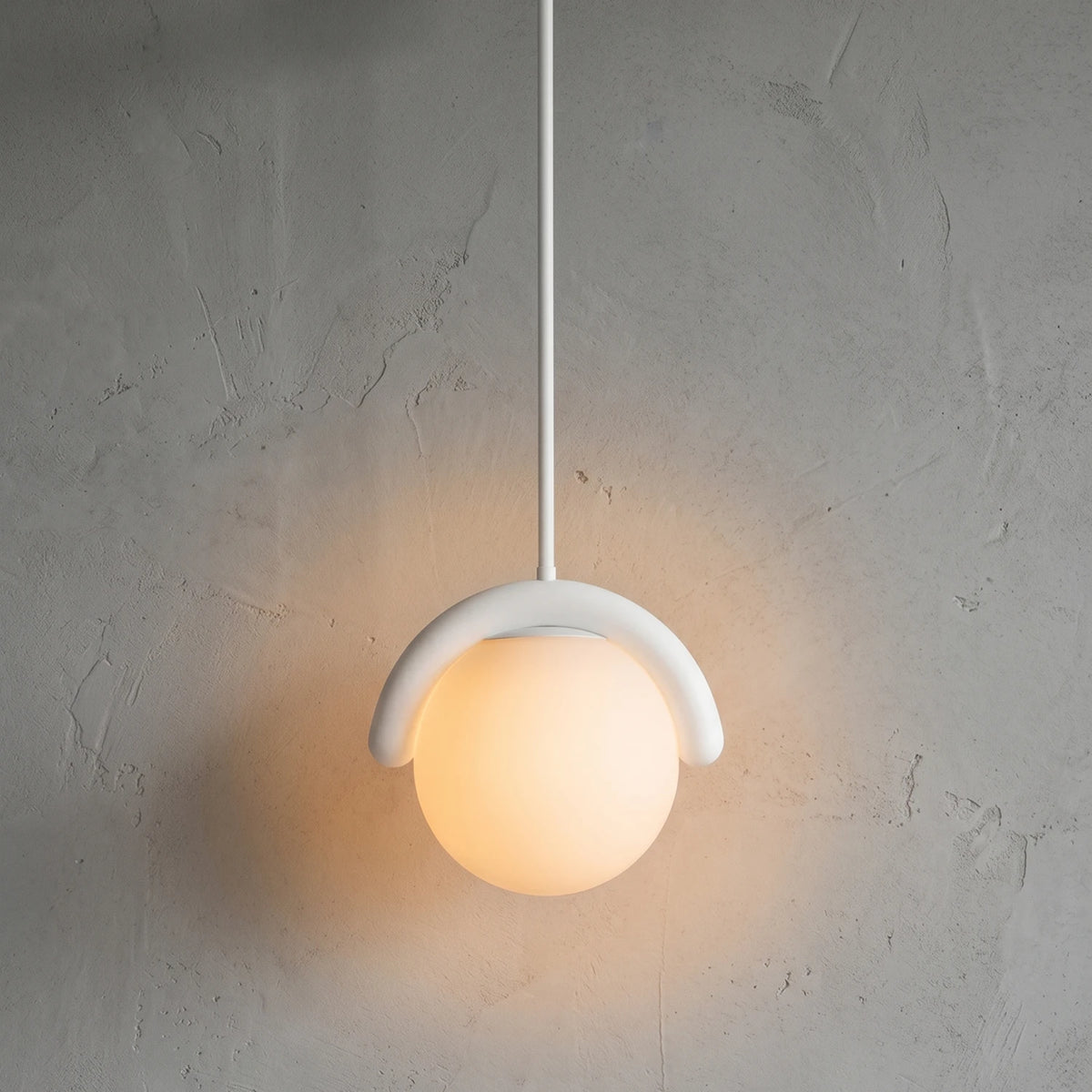 Curved Linear Opal Globe Pendant - White Single Globe Illuminated Glow | HoaiLamp