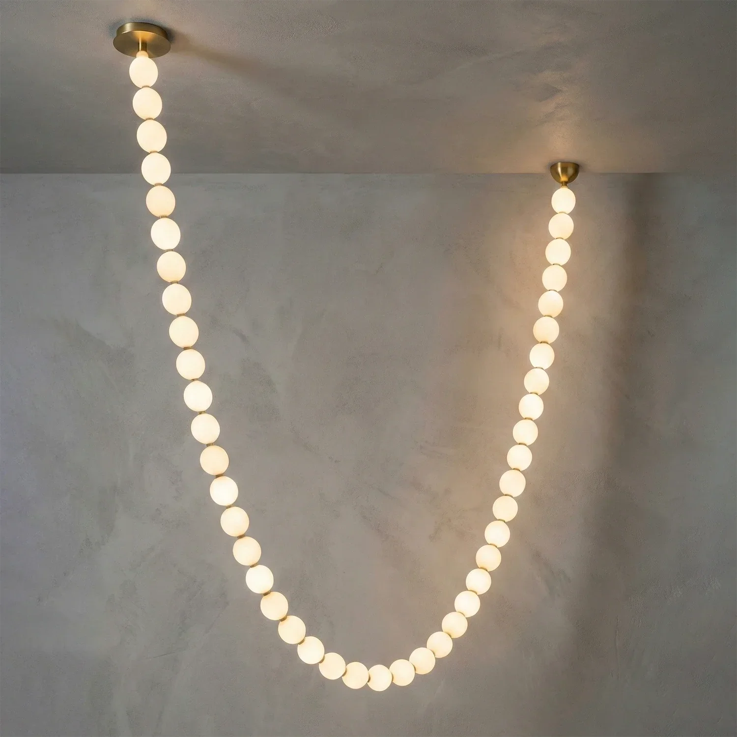 Dazzling Pearl Necklace Chandelier - Studio Grey Concrete Backdrop Single Strand Deep U Shape Narrow | HoaiLamp