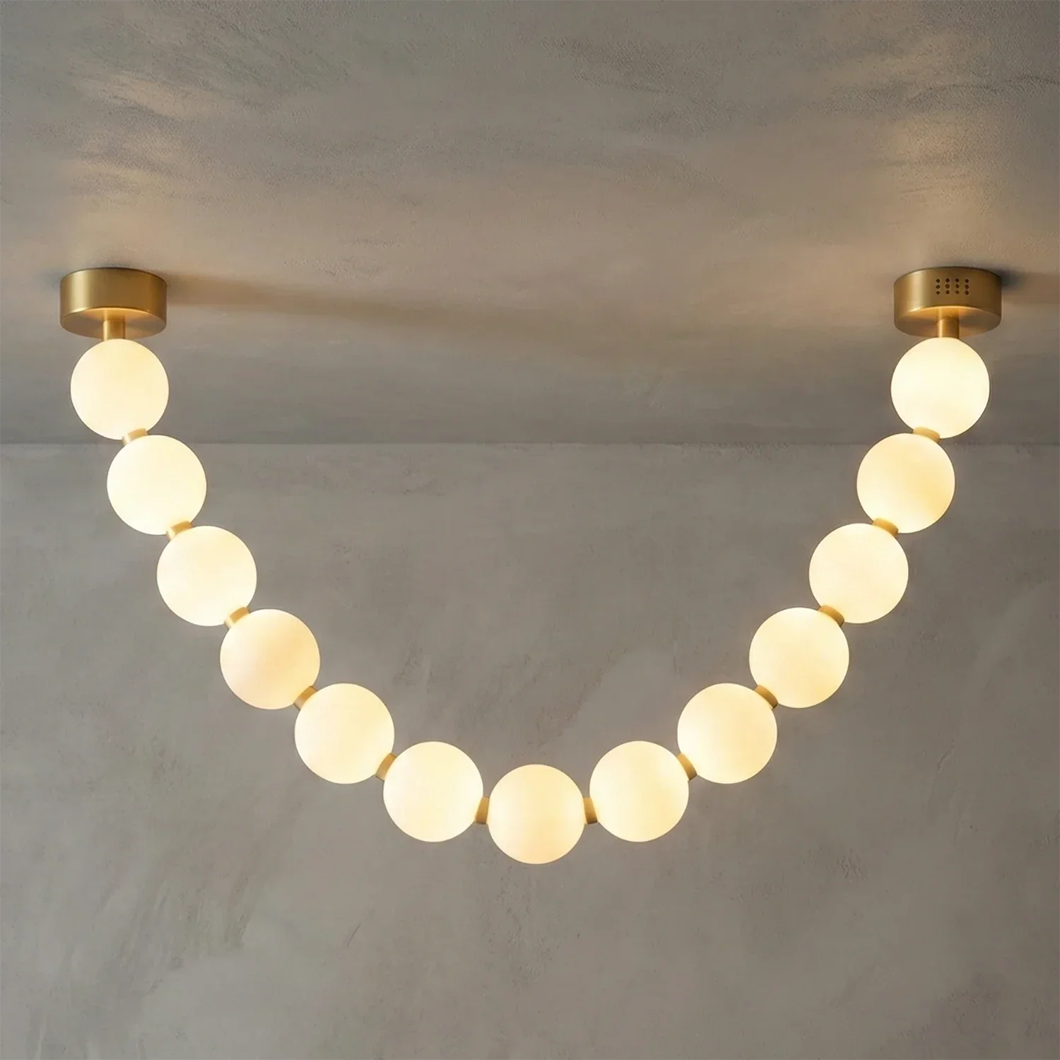 Dazzling Pearl Necklace Chandelier - Studio Grey Concrete Backdrop Single Strand Warm Lit | HoaiLamp