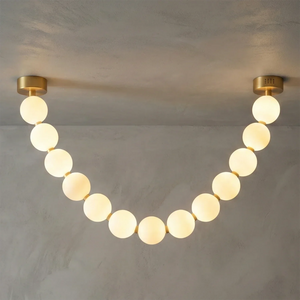 Dazzling Pearl Necklace Chandelier - Studio Grey Concrete Backdrop Single Strand Warm Lit | HoaiLamp