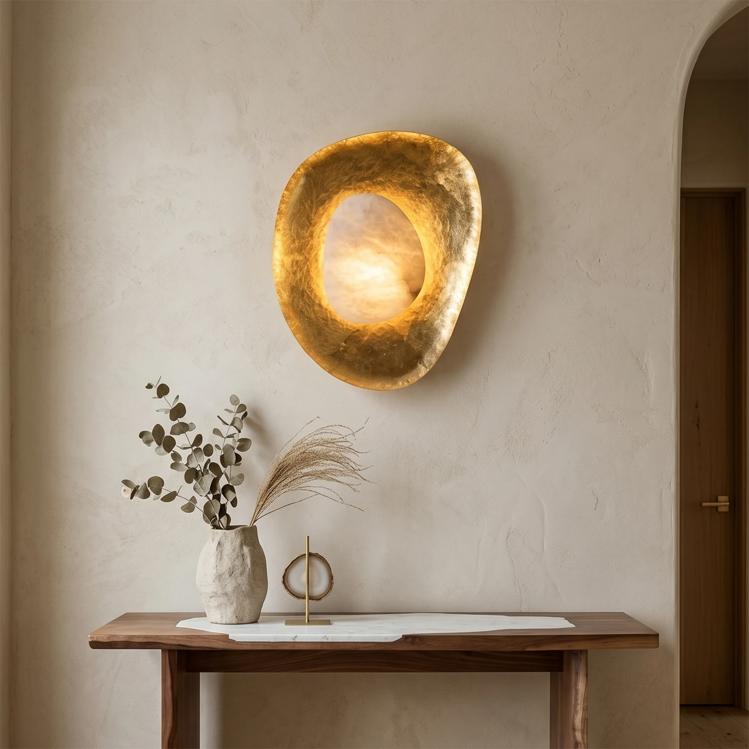 Hand crafted hammered metal lotus leaf wall sconce on wooden console table