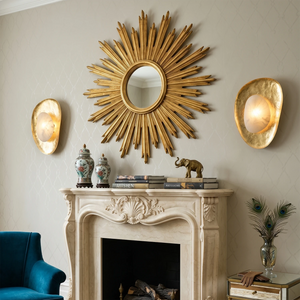 Hand crafted hammered metal lotus leaf wall sconce on classic fireplace sides