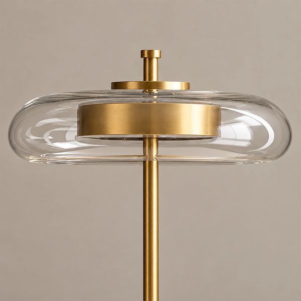 Close-up of the brass cap and knob sitting on top of the clear glass halo.