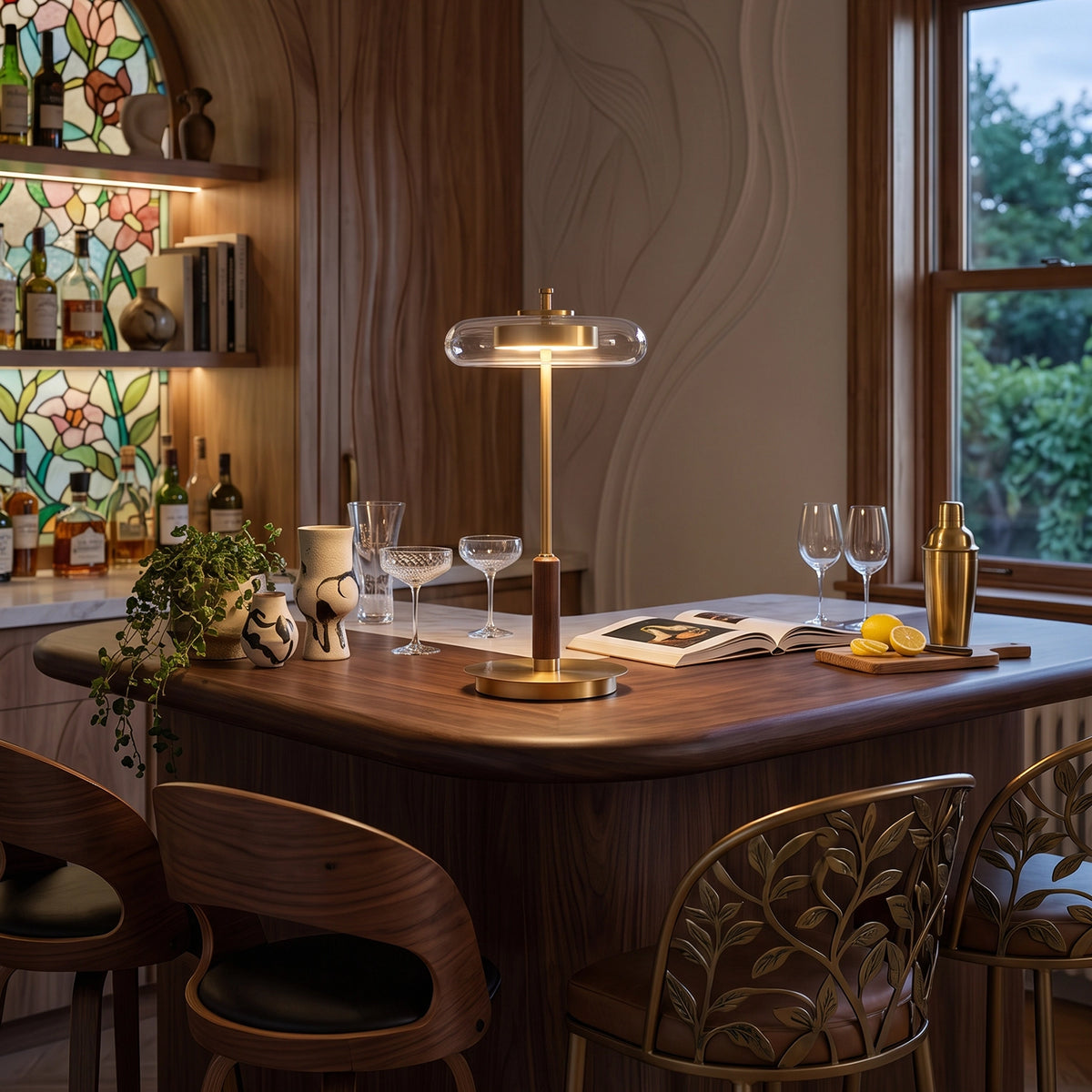 The Loria lamp glowing at medium brightness in a classic dining room with a walnut table.
