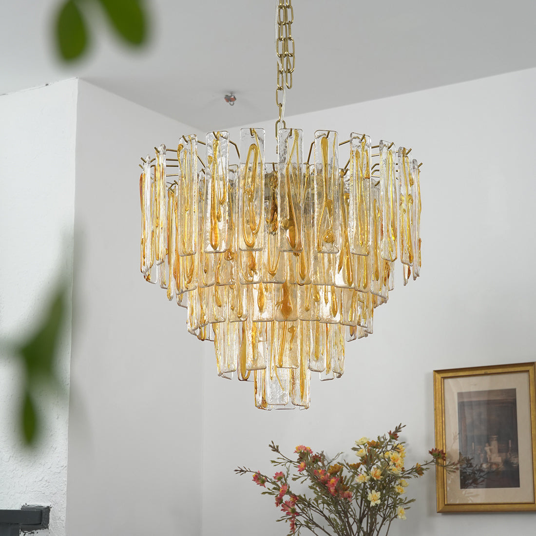 Murano Style Amber Glass Tiered Chandelier - Corner Wall Perspective Greenery Foreground | HoaiLamp