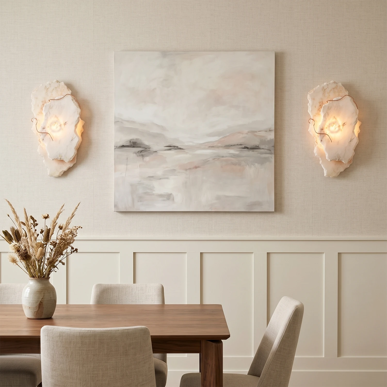 Hand-carved alabaster wall sconces with warm glow, flanking abstract art in modern dining room