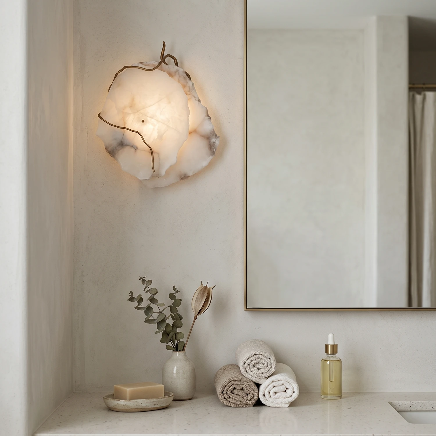 Hand-carved alabaster wall sconce with warm glow, modern bathroom lighting, natural stone texture