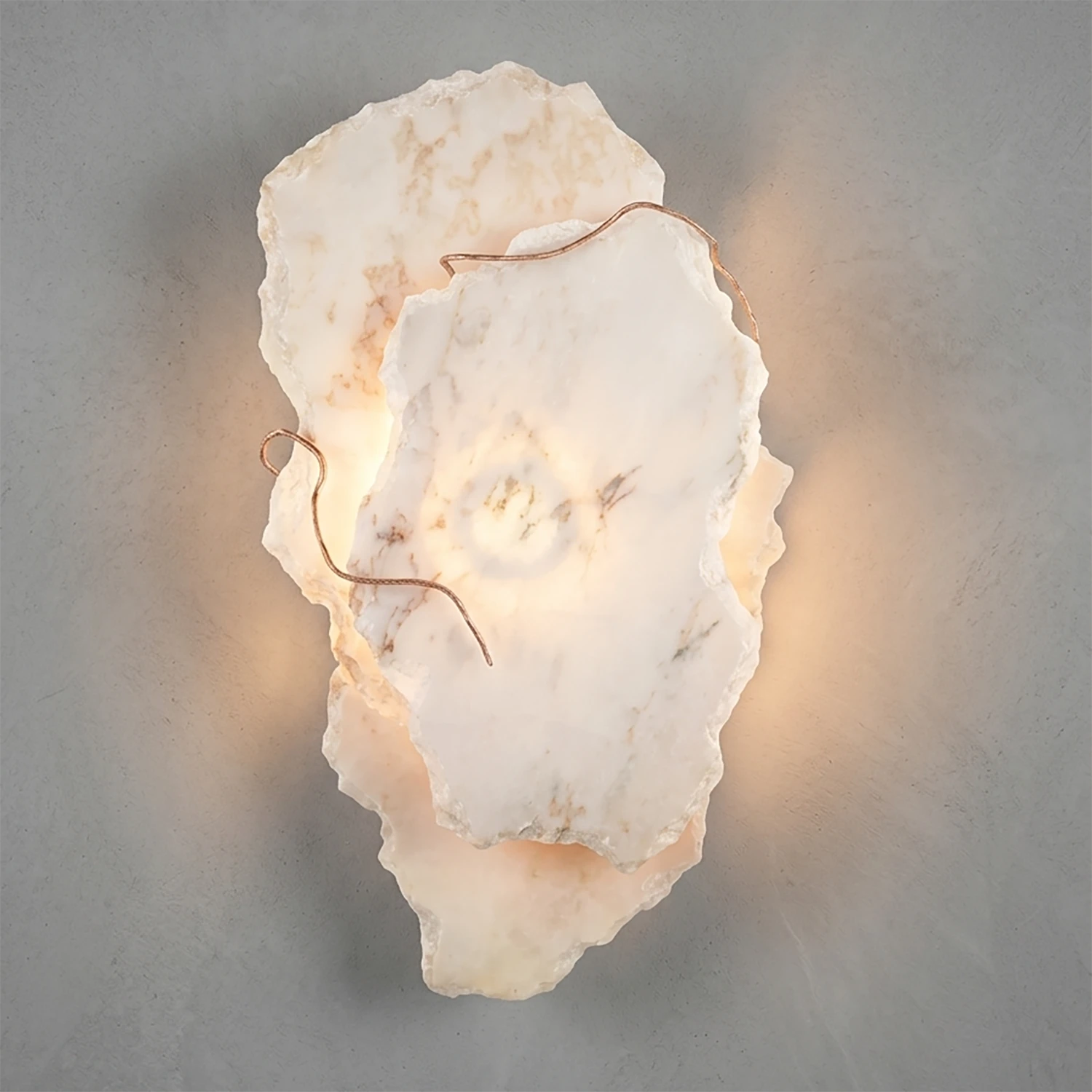 Hand-carved alabaster wall sconce with warm glow and natural stone texture, modern luxury lighting