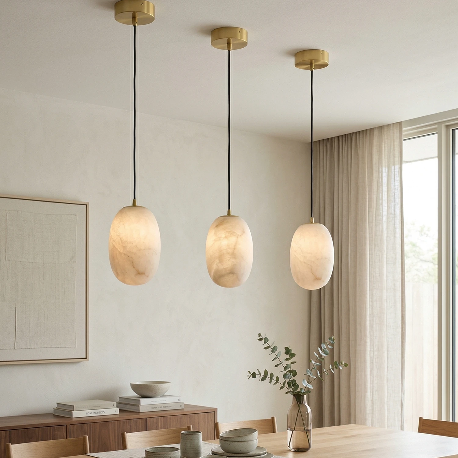 Oval Alabaster Pendant Light - Bright Dining Area with Three-light Linear Alabaster Pendant Arrangement | HoaiLamp