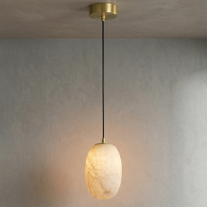 Oval Alabaster Pendant Light - Atmospheric Interior Shot of a Glowing Alabaster Pendant against a Plaster Wall | HoaiLamp