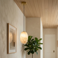 Oval Alabaster Pendant Light - Warm Hallway Ambiance with Single Alabaster Pendant and Natural Wood Ceiling | HoaiLamp