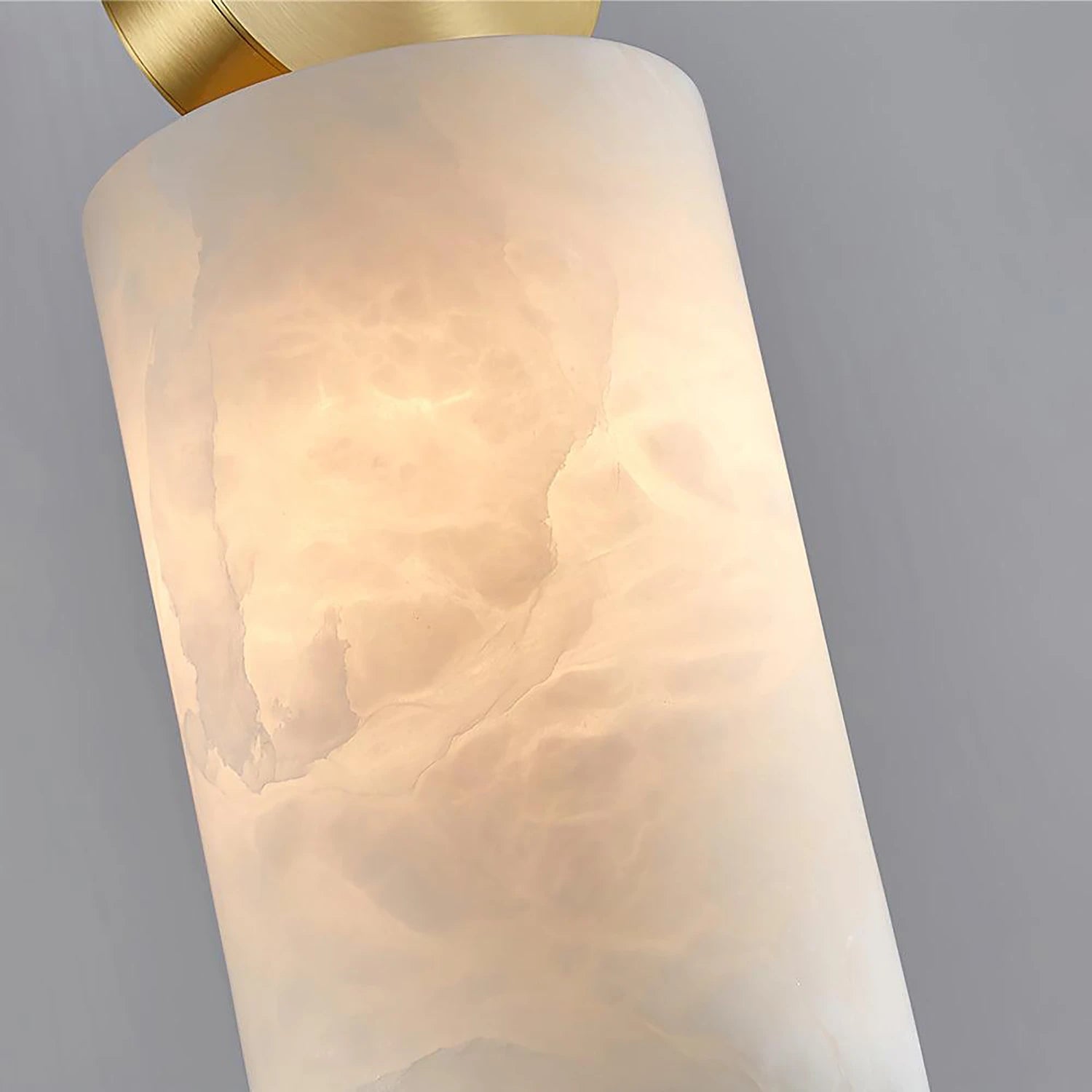 Close-up of swirled grain running through the lit alabaster stone