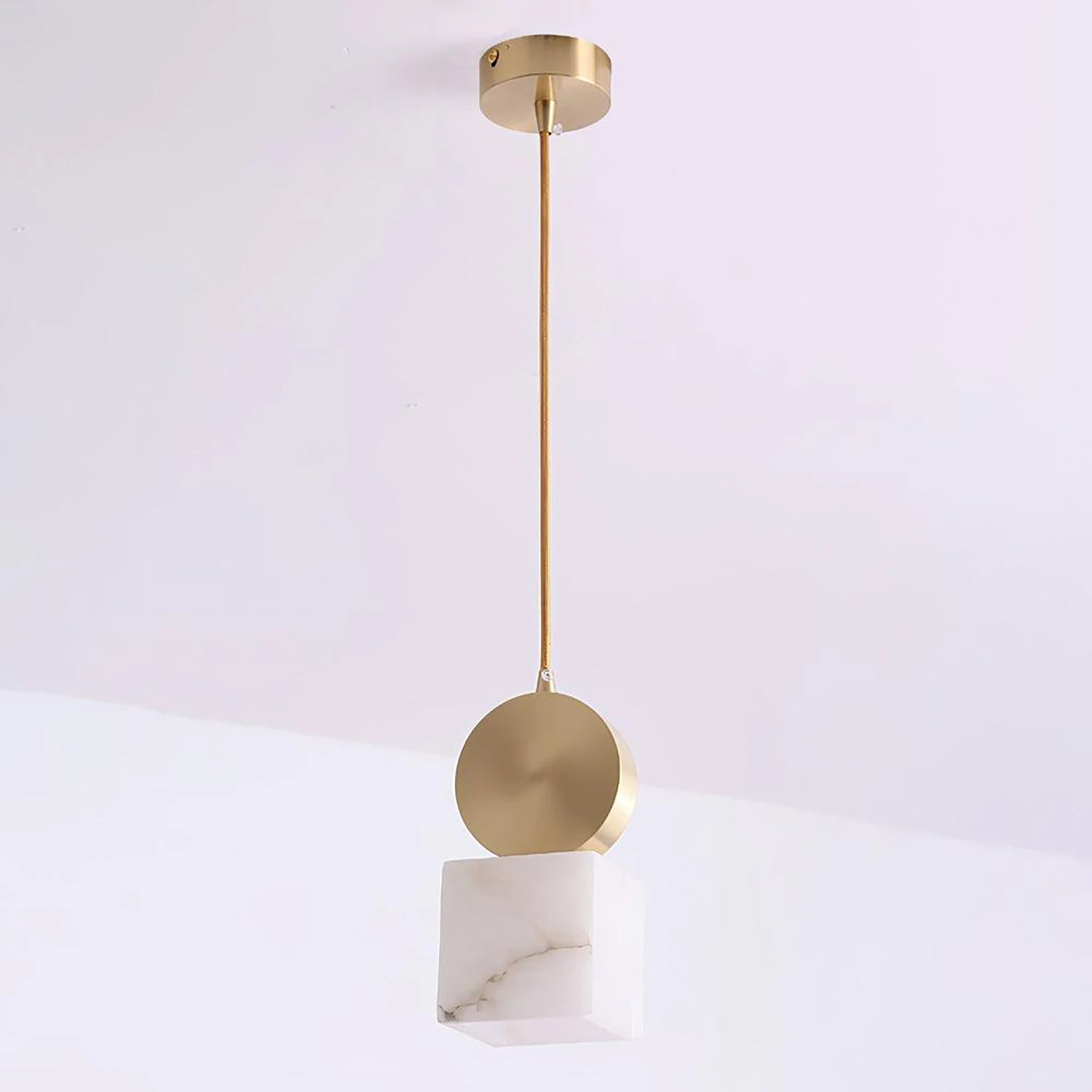 Cube alabaster pendant photographed at an angle on a white background