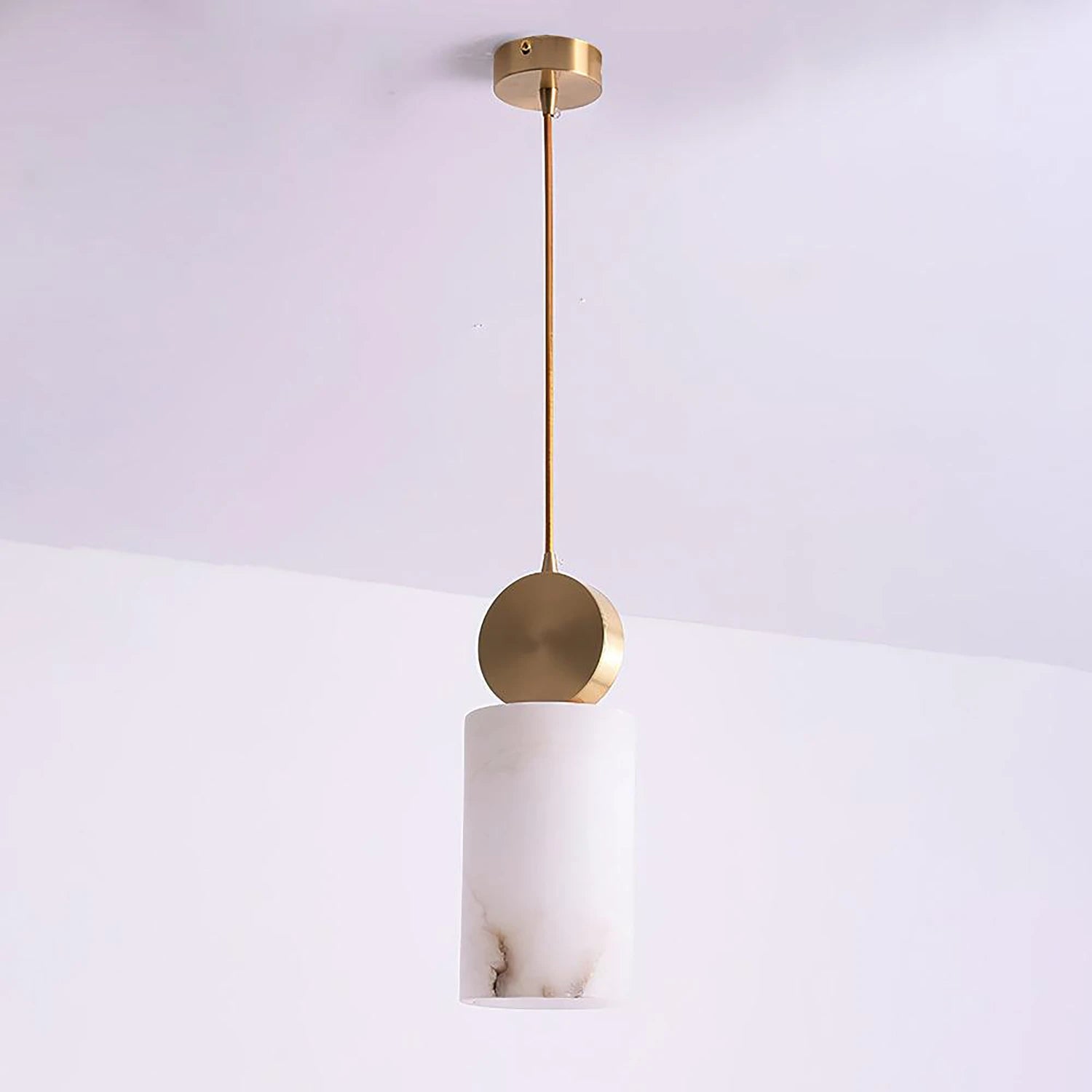 Illuminated cylinder alabaster pendant seen from an angle