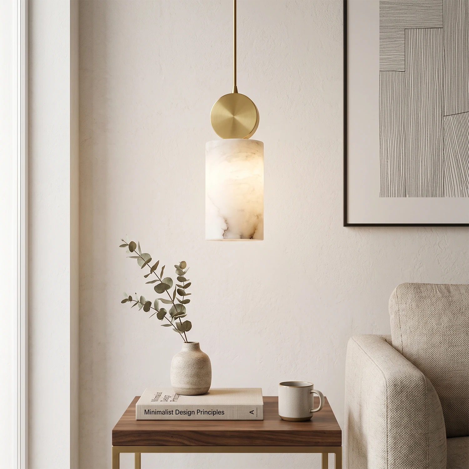 Brass-capped alabaster pendant hung low over a living room side table nook