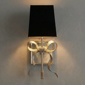 Ribbed Ribbon Bow Wall Lamp - Studio Grey Wall Lit Gold Finish Black Shade Front View | HoaiLamp