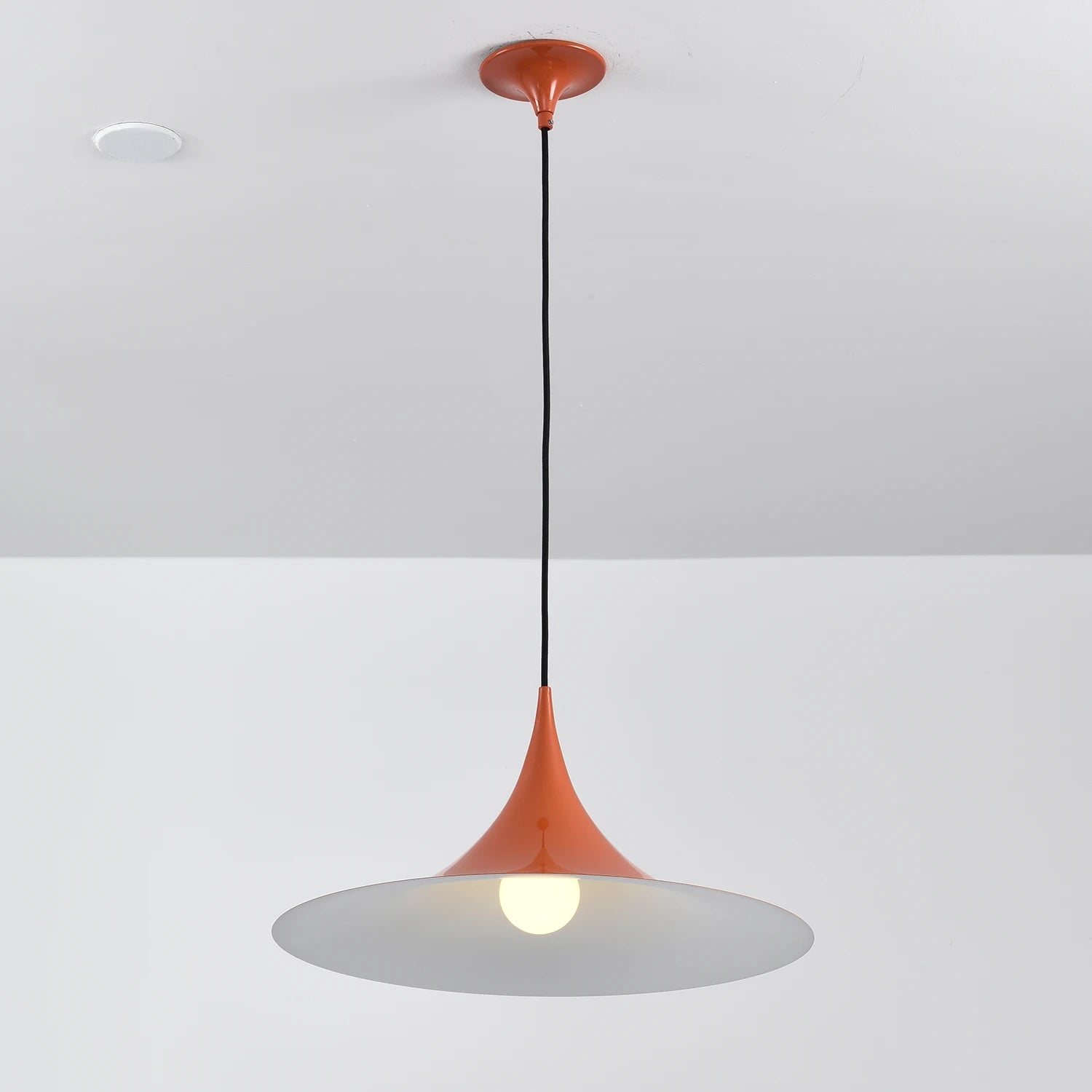 Sami Trumpet Pendant Light - Bold Terracotta Orange Bottom-Lit Studio View | HoaiLamp