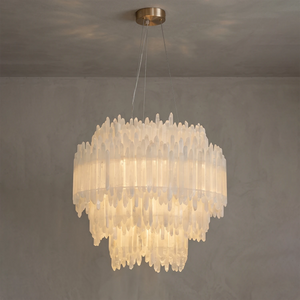 Luxury selenite layer pendant light featuring natural raw crystal layers glowing with warm ambient light.