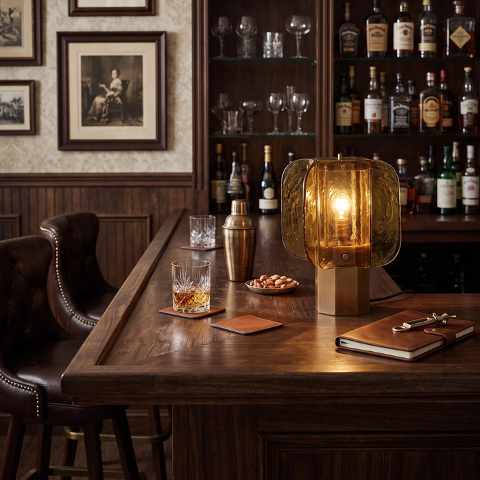 The Tramonto lamp lit on a vintage bar counter.