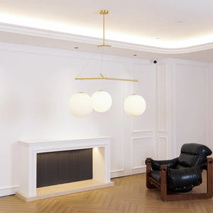Triple Glass Orb Pendant Lamp-Bar Linear Chandelier - Showroom Studio White Fireplace Mantel Leather Lounge Chair | HoaiLamp